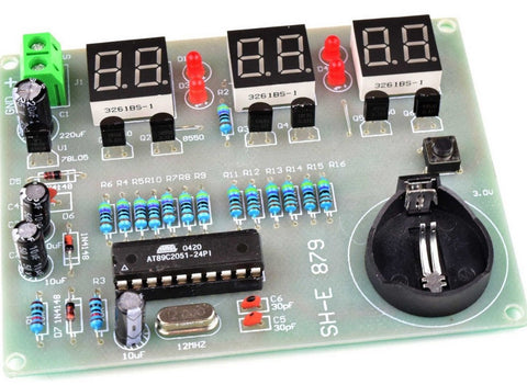 Circuit board with a variety of soldered components attached.